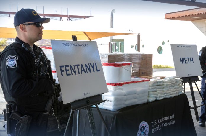 U.S. CBP officer with seized fentanyl