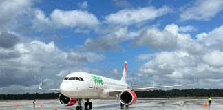 A VivaAerobus airlines plane parked on the runways at Tulum International Airport