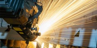 Sparks flying off a machine in a factory