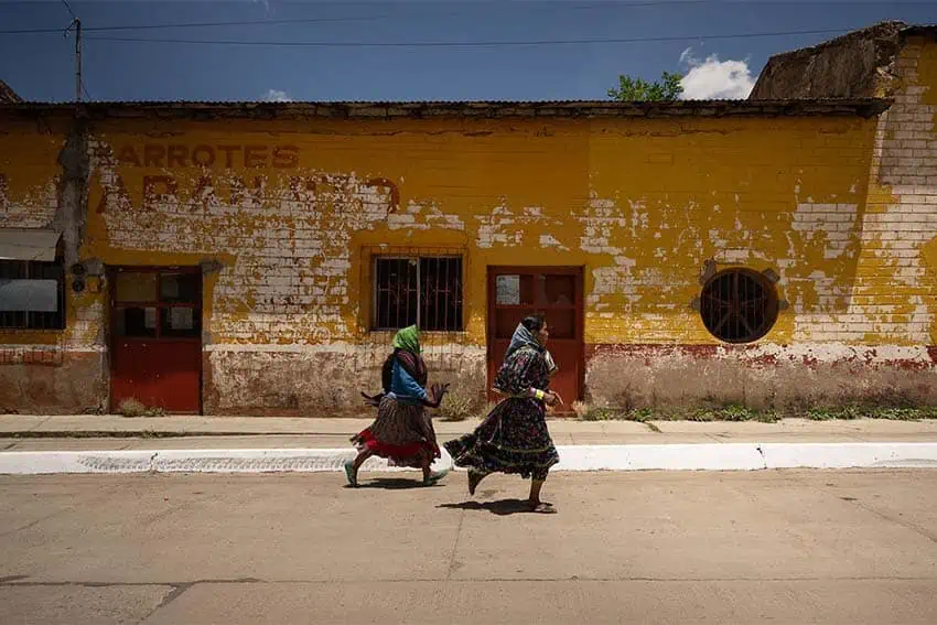 indigenous raramuri women running through a town in Chihuahua, Mexico
