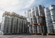 Beer kegs stacked on shipping pallets