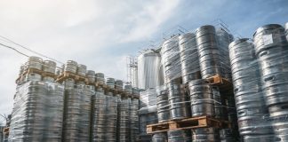 Beer kegs stacked on shipping pallets