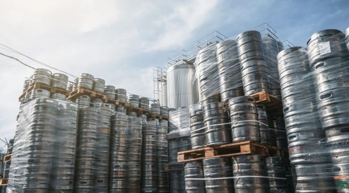 Beer kegs stacked on shipping pallets