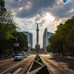 A long perspective view of Reforma Avenue in Mexico City