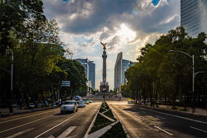 A long perspective view of Reforma Avenue in Mexico City