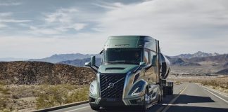 A Volvo truck driving down a highway