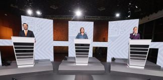 Mexico's presidential candidates at lecterns in a debate