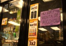 Sign that says "no alcohol sales" at a convenience store