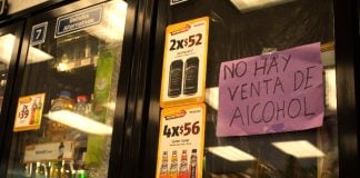 Sign that says "no alcohol sales" at a convenience store