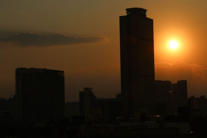 A blazing sun sets on the horizon after a 10-day heat wave across Mexico