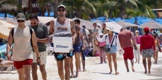Mexican and international tourists enjoy the white sand beaches of Islas Mujeres, in April.