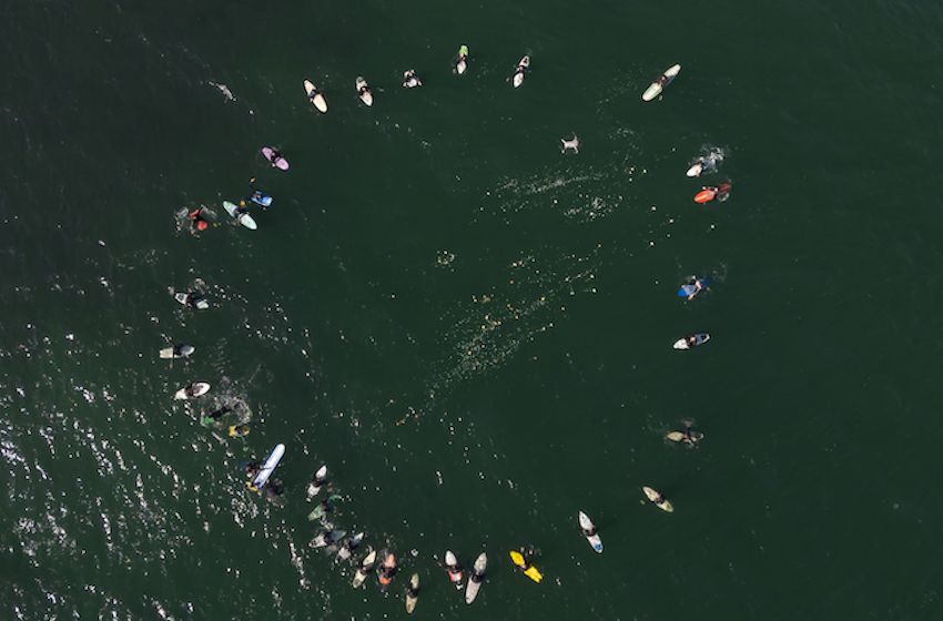 Baja California surfers organized a paddle out on Sunday in memory of the three foreign surfers who were killed near Ensenada