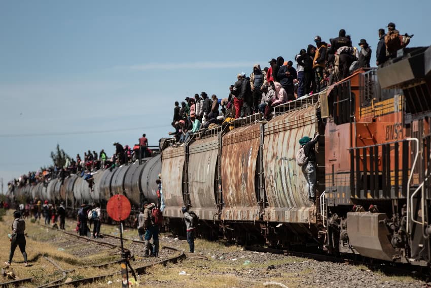 Migrants on top of a freight train
