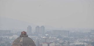 Mexico City skyline under heavy air pollution obscuring the view