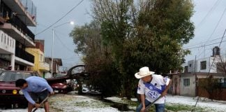 Puebla residents shovel hail that seemingly struck out of nowhere on Saturday.