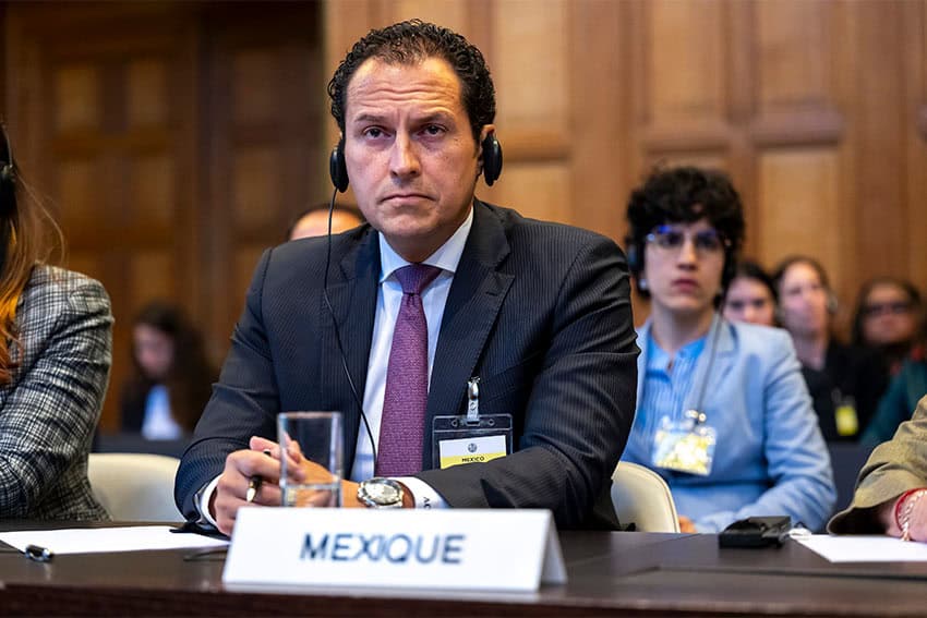 Mexico's representative in the ICJ proceedings, Alejandro Celorio Alcántara sitting in a suit in the ICJ courtroom with translation headphones on