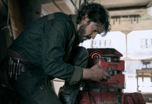 Actor Diego Luna, who will receive an award at the Guadalajara Film Festival, hunched over a machine part in a tool workshop in the Star Wars film "Andor"