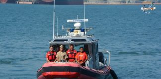 Members of Mexico's Navy travel on a rescue boat