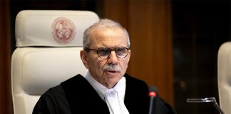 International Court of Justice President Nawaf Salam sitting in a proceeding at The Hague