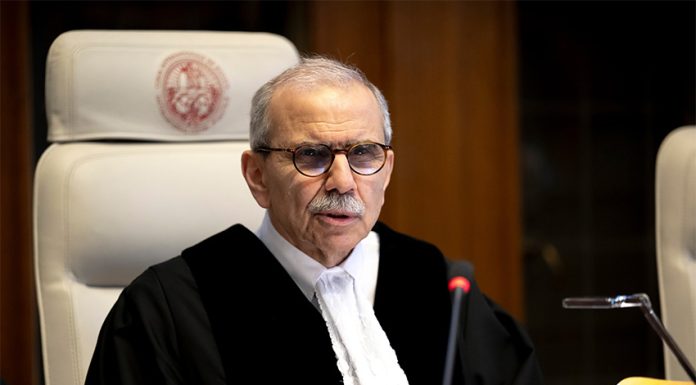 International Court of Justice President Nawaf Salam sitting in a proceeding at The Hague