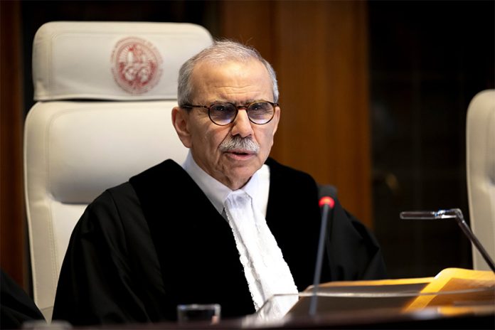 International Court of Justice President Nawaf Salam sitting in a proceeding at The Hague