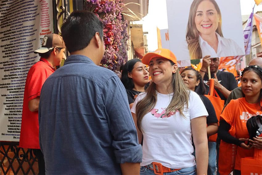 Jessica Ortega talks to a supporter at an April campaign event in Tepotzlán, Morelos. 