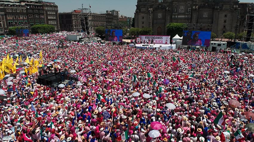 Pink-clad protesters fill Mexico City's central square on Sunday.