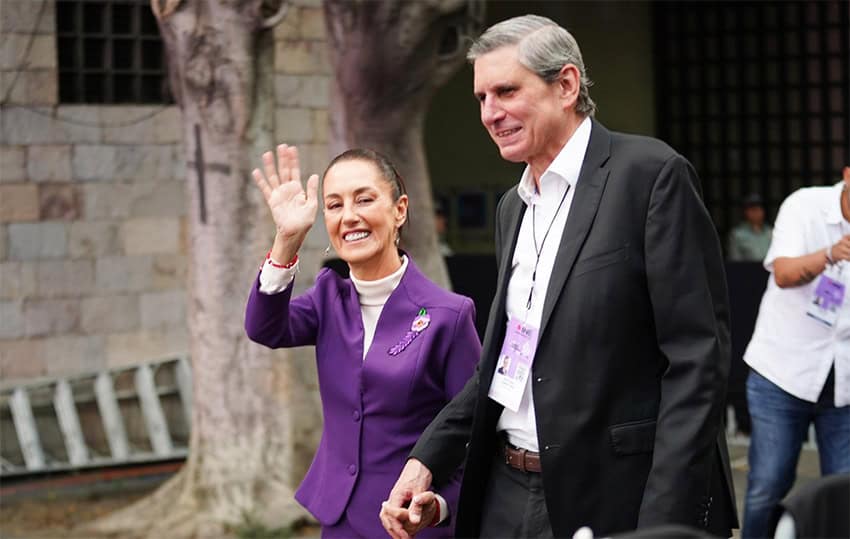 Claudia Sheinbaum, AMLO's chosen successor, waves to the camera as she walks out of the presidential debate shortly before Mexico's June elections.