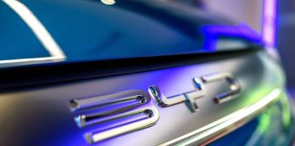 The BYD logo shines on the back of a vehicle