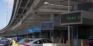 Cars pass through the San Ysidro-Tijuana border crossing, where the convicted customs officer worked.