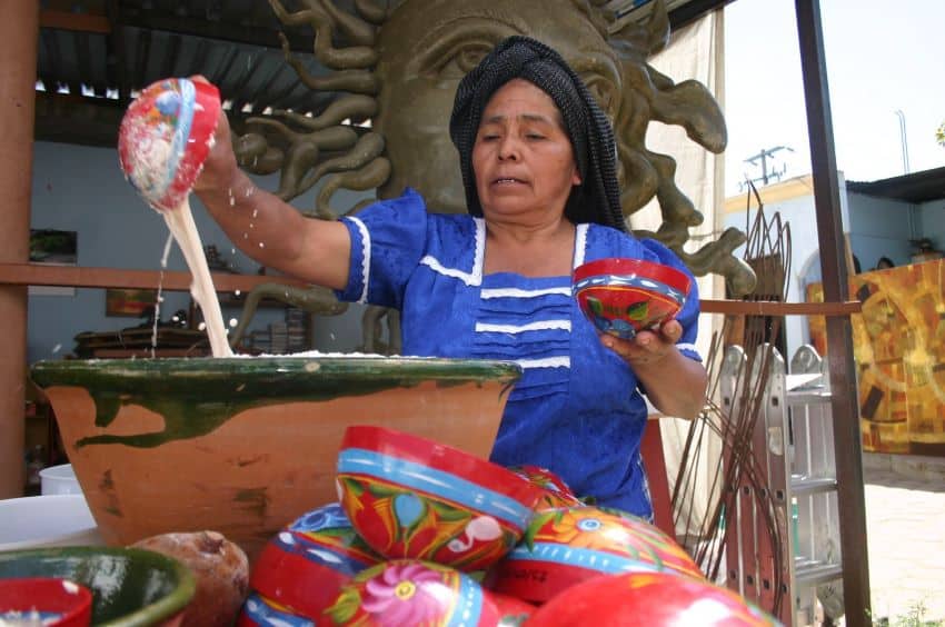 Mexican woman serving tejate