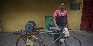 Knife sharpener on his bike