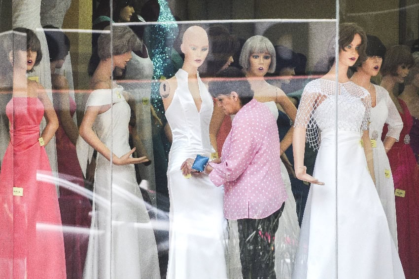 Wedding dresses on mannequins in a shop window in Mexico City