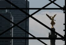 Mexico City's Angel of Independence appears behind scaffolding