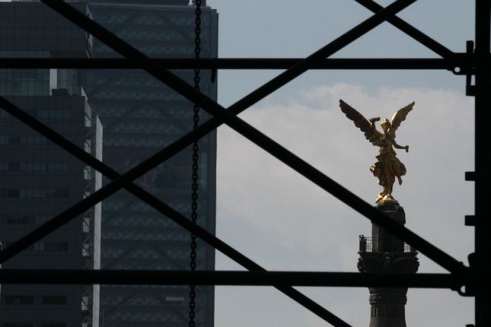 Mexico City's Angel of Independence appears behind scaffolding