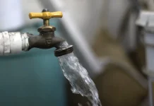 A faucet with water coming out