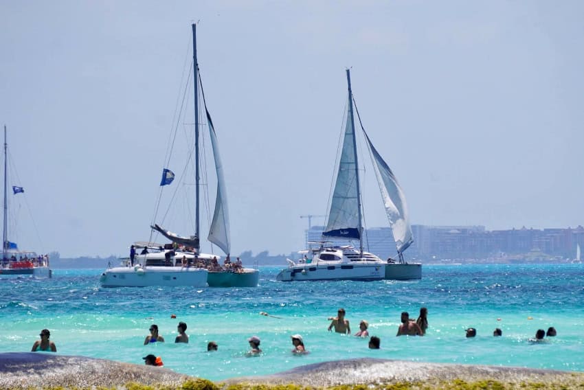 Isla Mujeres sailboats and tourists