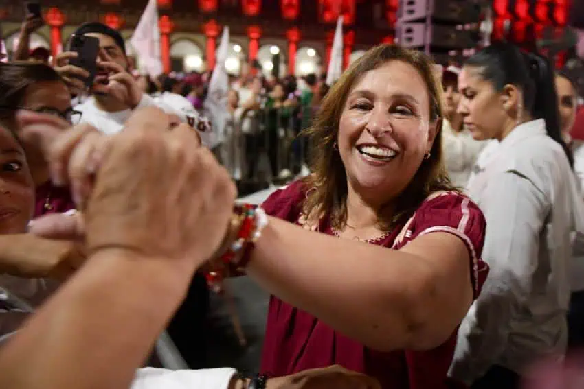 Rocío Nahle shakes hands with supporters after early results showed her winning the Veracruz gubernatorial election in Mexico.