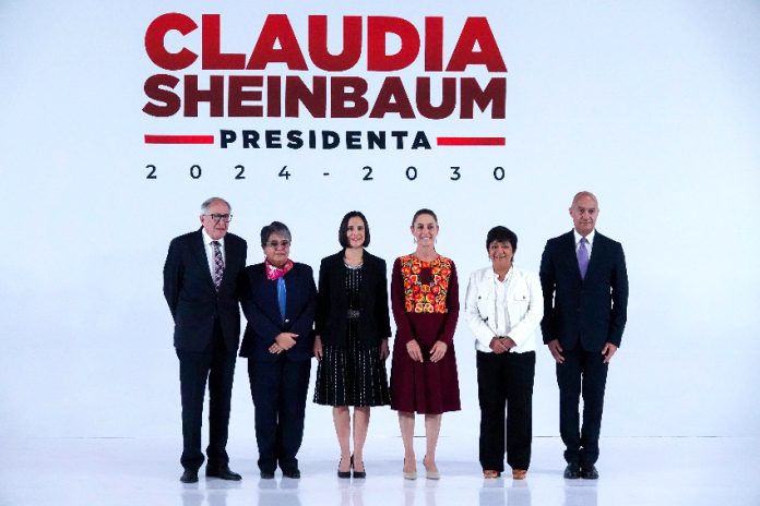 Claudia Sheinbaum at a press event with five newly announced cabinet members