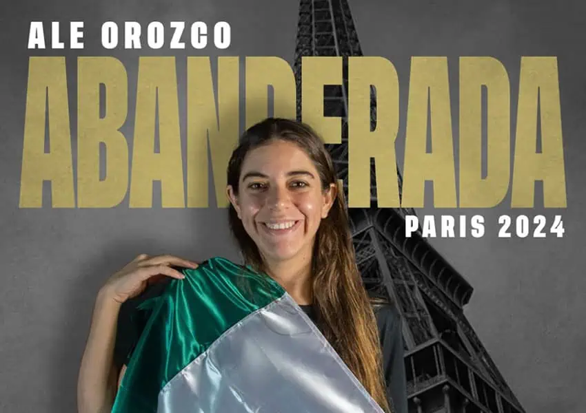 poster of Mexican diver Ale Orozco draped in the Mexican flag behind life-sized image of the Eiffel Tower