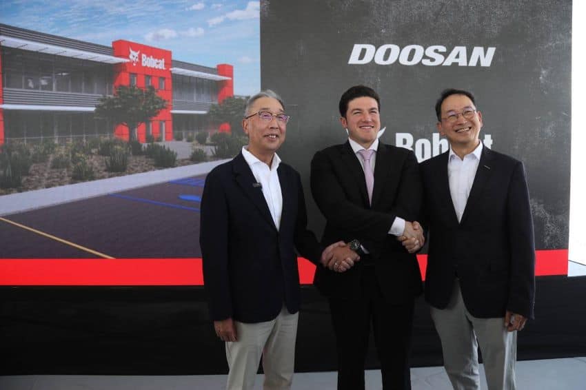 Nuevo León Governor Samuel García shakes hands with Doosan Group CEO Geewon Park and Doosan Bobcat CEO Scott Park, at the groundbreaking of Doosan Bobcat's new manufacturing plant in Mexico.