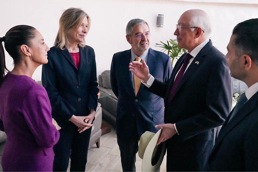 US Ambassador to Mexico Ken Salazar gesturing with one hand to Mexico's President-elect Claudia Sheinbaum, United States Homeland Security Advisor Liz Sherwood-Randall and others,