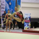 Mexican Olympic team member of the rhythmic gymnastic team performing with hoops