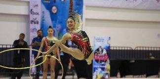 Mexican Olympic team member of the rhythmic gymnastic team performing with hoops