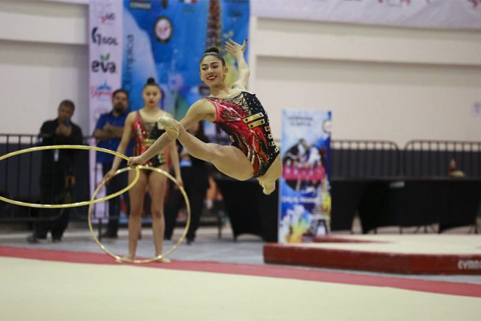 Mexican Olympic team member of the rhythmic gymnastic team performing with hoops