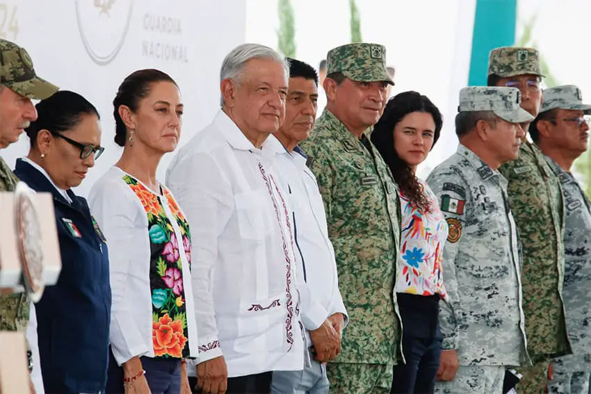 President-elect Sheinbaum stands in a row with President López Obrador and military and National Guard officials