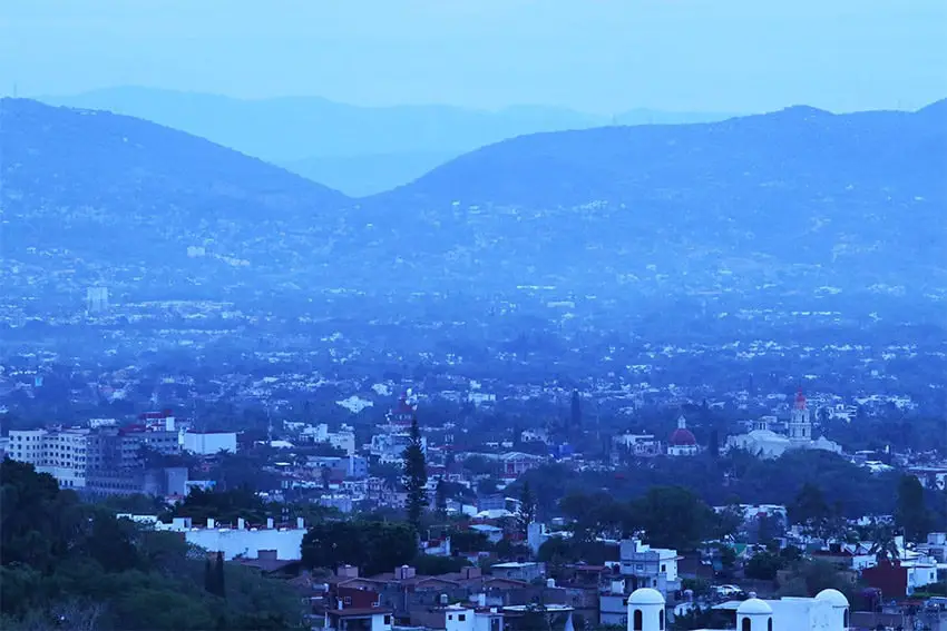 A mist of rain covers a cityscape of the capital of Cuernavaca.