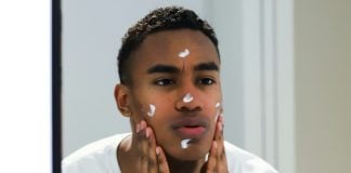 Man applying skincare cream