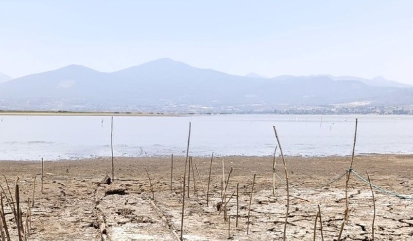The beach on Janitzio Island, where an ancient artifact of a traditional Purepecha canoe called a tepari was found just under the surface of the island's hard mud. Lake Patzcuaro is in the background.