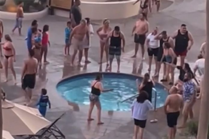 Worried guests gather around a hot tub in Puerto Peñasco